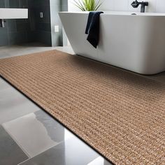 a bath tub sitting on top of a bathroom floor