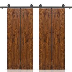 two wooden doors with metal handles on each side and an intricate design in the middle