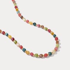 Embrace the vibrant energy of summer with our Colorful Seed Bead Necklace! This delightful piece features a playful mix of colorful natural stones, strung on a durable brass base plated in gleaming 18K gold. This bohemian-inspired necklace will add a touch of elegance to your style. Perfect for summer adventures or adding a pop of color to your holiday outfit. Find your perfect combination of natural stones and showcase your summer style! DETAILS Plating: 18K Gold Materials: 18K Gold on Brass, N Gold Beaded Necklaces With Natural Stones For Festivals, Multicolor Faceted Beads Necklace For Summer, Multicolor Beaded Chain Necklace For Vacation, Summer Multicolor Faceted Beaded Necklaces, Adjustable Natural Stones Beaded Necklace For Summer, Adjustable Beaded Necklaces With Natural Stones For Summer, Summer Multicolor Jewelry With Natural Stones, Adjustable Natural Stone Beaded Necklaces For Summer, Summer Multicolor Natural Stones Jewelry