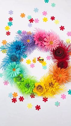 colorful paper flowers arranged in the shape of a circle