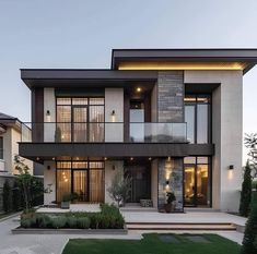 a large modern house with lots of windows