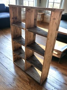 a wooden shelf sitting on top of a hard wood floor