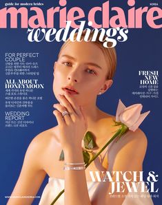 the cover of marie claire's wedding magazine, featuring a woman in white dress holding a rose