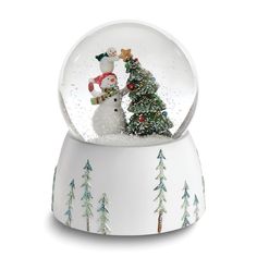 a snow globe with a snowman and christmas tree inside