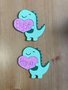 two dinosaur magnets with the words fluse and ataya written on each one