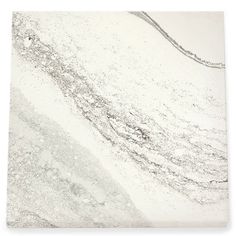 a white marble tile with grey streaks on it