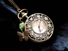 "This lovely Art Nouveau pendant watch necklace comes with a romantic real flower cabochon in green or teal and a butterfly! The spring lid is decorated with garlands and flowers and reminds the back delights with fine floral patterns. The color green represents the principle \"hope\", and stands for spring and summer. Green is also the color of the heart chakra, and the butterfly stands for metamorphosis and spiritual ascension! The butterfly with flowers will be the right gift for women who lo Modern Pocket Watch, Teal Butterfly, Spiritual Ascension, Bronze Gifts, Pendant Watch, Flower Watch, Pocket Watch Necklace, Terrarium Jewelry, Art Nouveau Pendant