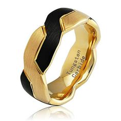 a gold and black ring on a white background