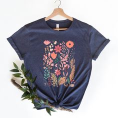 🎁 WELCOME TO OUR SHOP! Our graphic tees, sourced from the well-known brand BELLA+CANVAS, are both soft and trendy. They are long enough to wear with a pair of leggings, and soft enough to roll the sleeves, and if you want to add some flair, just tie it up in a knot. However you decide to wear it, you'll love the fit and comfort of this tee. 🛒 HOW TO ORDER 1️⃣ Select the shirt size & color. 2️⃣ Select the quantity. 3️⃣ Click "ADD TO CART". 4️⃣ You can go back to add more products for your loved ones. 5️⃣ You can now complete the checkout process. Please "Click Proceed to Check Out". 6️⃣ Finally, you have completed all the steps, and your product will be prepared to be shipped. ❗️ CARE INSTRUCTIONS To keep your new favorite tee looking and feeling great, follow these care tips: * Avoid usi Botanical Screen Print Short Sleeve T-shirt, Botanical Screen Print Crew Neck T-shirt, Pink Cotton T-shirt With Plant Print, Botanical Short Sleeve Graphic Shirt, Botanical Screen Print Cotton T-shirt, Botanical Graphic Print Short Sleeve Shirt, Blue Floral Print Graphic Tee, Blue Graphic Tee With Floral Print, Multicolor Crew Neck T-shirt With Plant Print