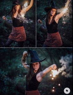 a woman dressed as a witch holding a sparkler in her hand and wearing a black hat