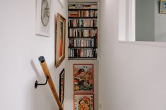 the hallway is decorated with books and pictures