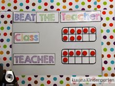 a bulletin board with the words beat the teacher class and an abacus on it