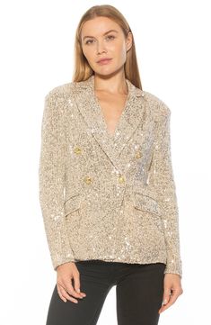 Glistening sequins add shimmer to a double-breasted blazer for a stand-out look. 27.5" length (size 2) Notched collar 90% polyester, 10% spandex Hand wash, dry flat Imported Model stats: 5'10" height, 32" bust, 25" waist, 36" hip. Model is wearing size 2. Glamorous Gold Blazer For Formal Occasions, Glamorous Gold Formal Blazer, Glamorous Metallic Formal Outerwear, Elegant Gold Sequined Blazer, Elegant Gold Sequin Blazer, Glamorous Embellished Outerwear For Holiday, Glamorous Evening Blazer For Spring, Spring Glamorous Embellished Blazer, Glamorous Metallic Blazer For Night Out