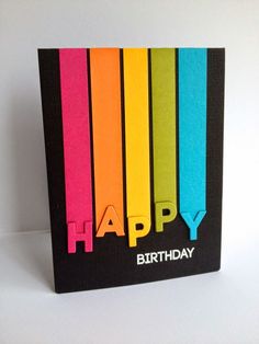 a birthday card with colorful crayons in the shape of letters that spell out happy