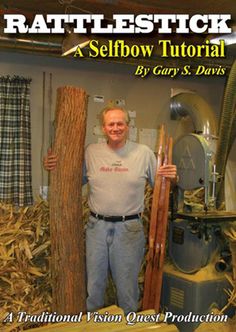 a man standing next to a pile of wood