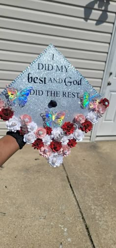 a graduation cap decorated with roses and butterflies that says, i did my best and god did the rest