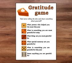 a card with some dices on it and the words gratitude game