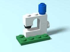 a white and blue lego object on a light blue background with the letter d in it's center