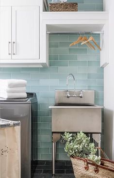 a laundry room with a sink, washer and dryer