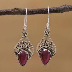 Sterling silver makes a fitting crown for striking garnets in these dangle earrings from Alok Jain. The sterling is crafted into arcs, dots, and curls in a perfect complement to the glow of the cabochon gems. Dark Earrings, Silver Chandelier Earrings, Ruby Pendant, Garnet Earrings, Silver Dangle Earrings, Sterling Silver Dangle Earrings, The Glow, Silver Earrings Dangle, Heart Jewelry