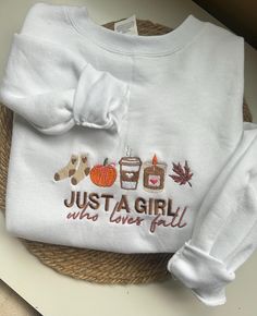 ✨Just a Girl Who Loves Fall✨ Embroidered Gildan Heavy Blend Crewneck This charming sweatshirt features adorable fall-themed icons and a heartwarming message that's perfect for crisp autumn days. Made from a premium blend of 50% cotton and 50% polyester, it offers unmatched softness and durability. Embrace the season in comfort and cuteness! White Embroidered Logo Sweater For Fall, White Letter Embroidery Sweatshirt For Fall, Cute White Sweatshirt For Fall, Relaxed Fit Letter Embroidery Sweater For Fall, Cute White Fall Sweatshirt, White Letter Embroidery Sweater For Fall, Cute Custom Embroidered Tops For Fall, White Sweater With Custom Embroidery For Fall, Embroidered Text Crew Neck Tops For Fall