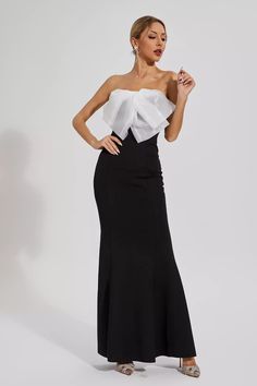 Elevate your evening glamour with the elegant Paisleigh Black White-bow Mermaid Dress. This captivating gown features a figure-flattering strapless bodice and a mesmerizing mermaid silhouette. Perfect for formal events and special occasions, this dress combines sophistication and allure with its eye-catching black and white bow detail.  Length: Approx 142cm Materials: Polyester Gentle Dry Clean Only  The model is 5 ft 7 and wears size S  Color may vary due to lighting on images. The product imag Svecane Haljine, Long Sequin Dress, Youtube Content, Mermaid Silhouette, Feather Dress, Gala Dresses, Evening Dresses Elegant, White Bow, Party Dress Long