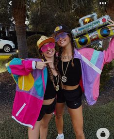 two women dressed up in costumes posing for the camera