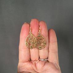 "Beautifully detailed 14k bright gold vermeil filigree teardrop flower charms simply dangle from 18k gold vermeil balled earwires. These lightweight go-with-everything earrings complete any outfit for daytime or evening. Gold flower charms: 19x29mm Total length of earrings: 1 1/2\" All gold is vermeil. A matching necklace is available... www.etsy.com/listing/942764148/gold-flower-pendant-necklace As the owner, maker, designer, and curator of this shop, I take great pride in providing you with je Teardrop-shaped Gold Plated Filigree Jewelry, Gold Plated Filigree Teardrop Jewelry, Gold Teardrop Pendant Jewelry With Matching Earrings, Pear-shaped Gold Earrings For Anniversary, Gold Teardrop Pendant Earrings With Ear Wire, Gold Teardrop Pendant Earrings For Gift, Gold Drop Pierced Jewelry, Gold Pear-shaped Teardrop Earrings As Gift, Gold Pear-shaped Teardrop Earrings For Gift