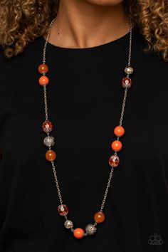 Infused with shiny silver beads and silver ornaments, a collection of glassy, polished, and crystal-like Amberglow beads drape across the chest for a colorful collision. Features an adjustable clasp closure.

 Sold as one individual necklace. Includes one pair of matching earrings. Silver Strand, Hanging Necklaces, Orange Necklace, Purple Pearl, Silver Ornaments, Teardrop Beads, Paparazzi Accessories, Blue Gems, Shiny Silver