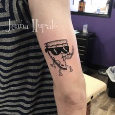 a person with a tattoo on their arm wearing sunglasses and holding a drink in his hand