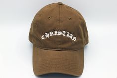 "JESUS SAVES Premium Dad Hat - with cross stitching on side Primary color - Hat Color Secondary color - Thread Color Moja Basics offers a variety of embroidered hats with designs that make our customers smile! Simply select a stylish design and choose a hat color that you love. Our hats are 100% cotton and have an adjustable buckle with an antique brass finish.  Product Description: 100% Cotton, Unstructured, Soft Crown Lining 6 eyelets Pre Curved Visor 6 Rows Stitching on Visor Garment Washed A Curved Brim Hat With Embroidered Text And Adjustable Fit, Beige Dad Hat With Embroidered Logo And Curved Brim, Adjustable Hats With Embroidered Text And Curved Brim, Embroidered Fitted Hat With Curved Brim For Streetwear, Embroidered Adjustable Dad Hat With Flat Brim, Embroidered Curved Brim Fitted Hat For Streetwear, Embroidered Cotton Dad Hat With Flat Brim, Adjustable Curved Brim Hat With Embroidered Text, Adjustable Brown Hat With Embroidered Logo