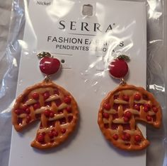 the earrings are made out of plastic and have cherries on them