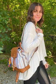 These backpacks are super cute! They are a mini size, have a bright multi-colored tassel, with removable and adjustable backpack straps, inside zipper and open pockets, and a top flap with a magnetic closure. * Dimensions: 9"L x 5"W x 10"H* Internal zip and slip pockets * Removable and adjustable backpack straps Multicolor On-the-go Backpack With Adjustable Strap, Multicolor Backpack With Adjustable Strap For On-the-go, On-the-go Multicolor Backpack With Adjustable Strap, Casual Multicolor Leather Backpack For School, Casual Multicolor Leather Backpack, Boho Backpack, Backpack Straps, Magnetic Closure, Rust