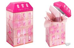 two boxes that have some kind of pink box on top of each other, one with a bow