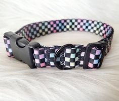 a black and pink checkerboard dog collar on a white furnishing background