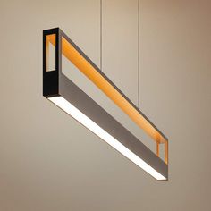 a suspended light fixture with an orange strip in the center and two lights above it