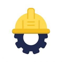 a yellow hard hat on top of a gear wheel