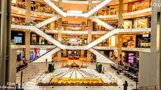 the inside of a large building with multiple floors and balconies on each floor