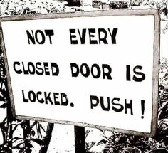 a black and white photo of a sign that says not every closed door is locked