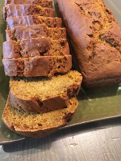 sliced loafs of banana bread on a green plate