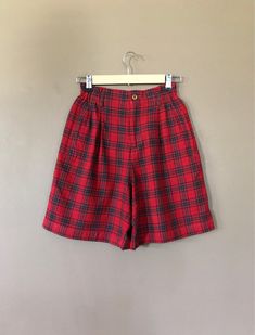 "Ultra high waisted 90's plaid shorts. Classic 90's red plaid pattern. Pleated accents in front with two front pockets and one back pocket. Shorts are in excellent clean condition. Very soft wool~rayon blend fabric. Measurements are taken zipped or buttoned up and laid comfortably flat then x 2 for total circumference (inches) Lizsport Tag Size 4 Waist 24~26\" stretch Hips 38\" Length 18.5\" Inseam 8\" Rise 12\" Bottom leg Opening Circumference 25.5\" All items are free of rips, tears, holes, an Fitted Plaid Casual Shorts, Fitted Casual Plaid Shorts, Vintage High Waist Plaid Bottoms, Plaid High Waist Cotton Shorts, High Waist Plaid Cotton Shorts, Vintage Plaid Bottoms For Summer, Vintage Plaid Summer Bottoms, Fitted Plaid Shorts, Plaid Bottoms With Built-in Shorts