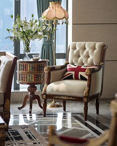 a living room filled with furniture next to a large window and potted plant on top of a table