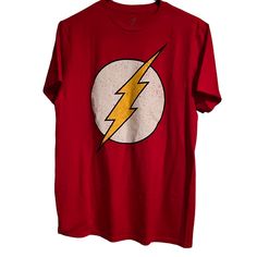 Brand New With Tags. Red Short Sleeve T-Shirt. Has The Flash Lightning Bolt Graphic Across The Front Chest. 100% Cotton. In A Men’s Size M. Can Be Unisex. Red Tops With Graphic Design For Fan Merchandise, Casual Graphic Design Shirt For Conventions, Red Graphic Tops For Fan Merchandise, Red Graphic Print Shirt For Fan Merchandise, Pop Culture Red Tops For Streetwear, Red Graphic Design Shirt For Fans, Red Pop Culture Top For Streetwear, Red Graphic Tops For Fan Gear, Red Pop Culture Tops For Streetwear