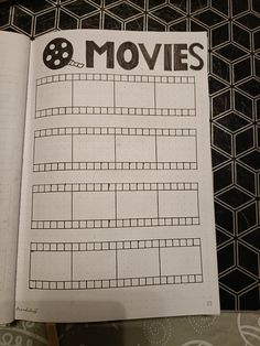 an open book with the words movies written in black and white on it's cover