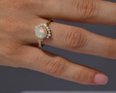 DetailsMaterial: 14k/18k GoldColor Options: Yellow Gold, White Gold, Rose Gold★ Center StoneEthiopian Opal, RoundSize: 8 mm Approx Weight (Ct): 1.215★ Accent StonesDiamond RoundSize: 1.8 mm * 2 Nos, 1.5mm * 3 NosApprox Weight (Ct): 0.092 Opal Diamond Ring, Phone Items, Natural Gemstone Jewelry, 18k Gold Ring, Recycled Gold, White Rose Gold, Gold Rose, Yellow Color, Gold Ring