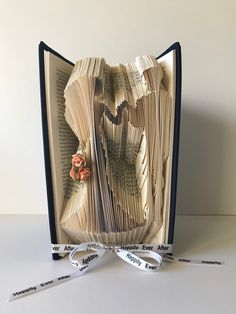 an open book that has been folded into pieces