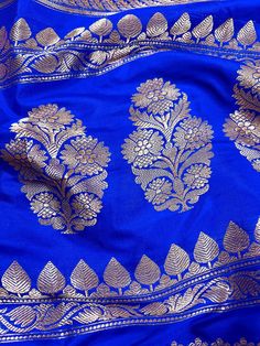 SILK MARK CERTIFIED !!Gorgeous Pure Katan Royal Blue Color with Copper and Slier Zari Work. Strips Sarees in Copper and Sliver Zari with Floral Buttas on the Pallu Soft, light weight and easy to drape Saree. The Strips are dense towards the pallu and get scattered the other end. Item : SareeColor : Royal Blue ColorBase Fabric : Pure Katan Silk Blouse piece : Comes with Blouse pieceBlouse material : Pure Katan SilkFall & Edging (Yes/No) : YesComes with Silk Mark Certificate (Yes/No) : Yes Disclai Blue Traditional Wear With Unstitched Blouse For Celebration, Blue Zari Work Blouse Piece For Celebration, Celebration Blue Blouse Piece With Zari Work, Blue Blouse Piece With Zari Work For Celebration, Bollywood Style Blue Blouse Piece For Celebration, Blue Zari Weaving Blouse Piece For Party, Blue Party Blouse With Zari Weaving, Traditional Blue Blouse Piece For Celebration, Festive Royal Blue Self-design Blouse Piece