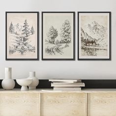 three framed drawings on the wall above a dresser