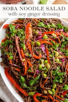 sobba noodle salad with soy ginger dressing in a white bowl on a wooden table