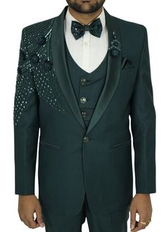 Elevate your style with our exquisite 6-piece wedding green tuxedo suit for men, showcasing a breathtaking shawl lapel and meticulously crafted hand embroidery. This suit is the epitome of elegance and sophistication, designed for those special moments in life where you want to make a remarkable impression. Every element of this tuxedo suit has been carefully considered, from the precisely tailored fit to the intricate hand embroidery that adorns it. The stunning green hue adds a touch of uniqueness to your formal attire, setting you apart from the crowd. Whether you're the groom, a guest, or simply a fashion-conscious individual, this suit is your go-to choice for weddings, galas, and other formal occasions. Its timeless style ensures you'll be the center of attention while exuding confid Green Tuxedo Suit For Wedding, Green Tuxedo Style Three-piece Suit For Wedding, Elegant Green Unstitched Suit For Wedding, Elegant Fitted Green Sherwani, Festive Green Ceremony Sets, Elegant Green Sherwani For Formal Occasions, Green Elegant Sherwani For Formal Occasions, Elegant Fitted Green Bandhgala, Green Tuxedo Blazer For Wedding